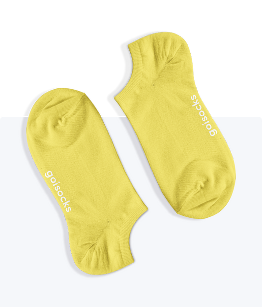 Egy pár egyszínű Vibráló Sárga Goisocks bokazokni.