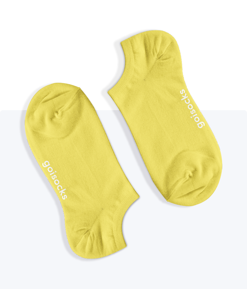 Egy pár Goisocks Bokazokni vibráló sárga színben.